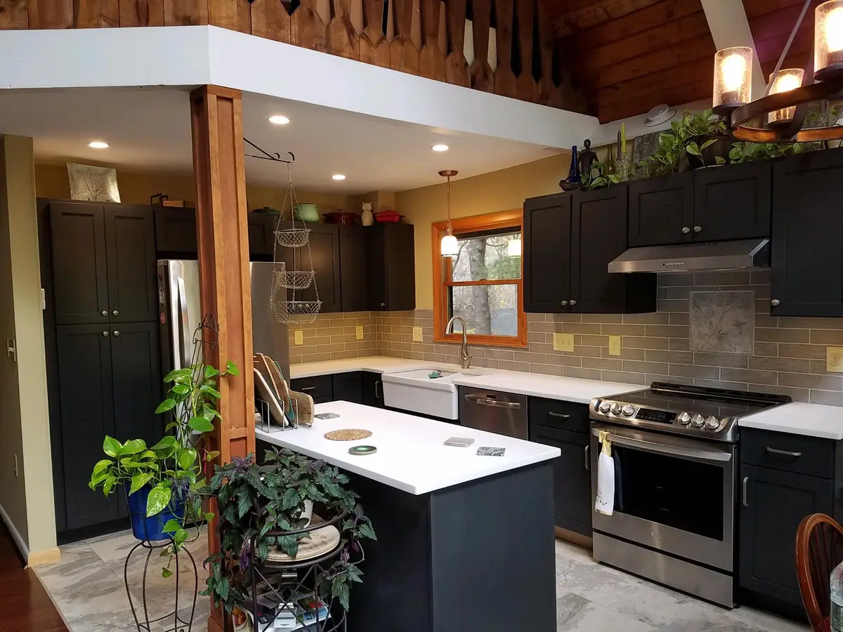 Charcoal shaker kitchen cabinetry with light quartz counters in a Dutchess County home